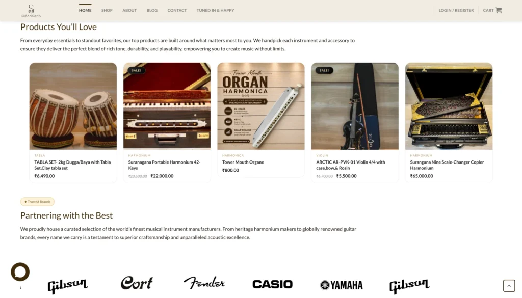 The Surangana products section showing tabla sets, harmoniums and violins with prices